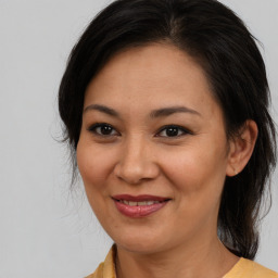 Joyful white adult female with medium  brown hair and brown eyes