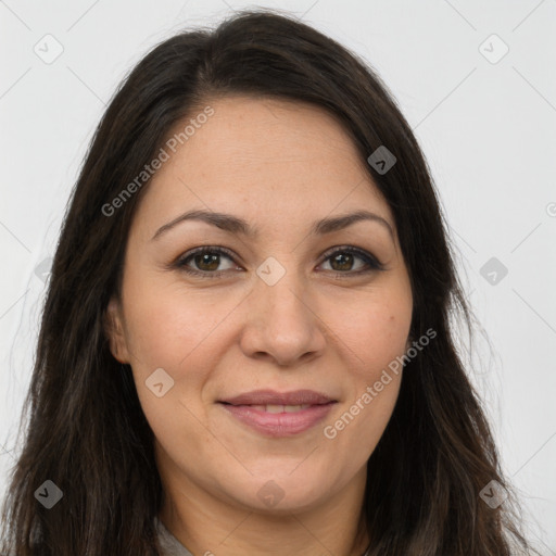 Joyful white adult female with long  brown hair and brown eyes