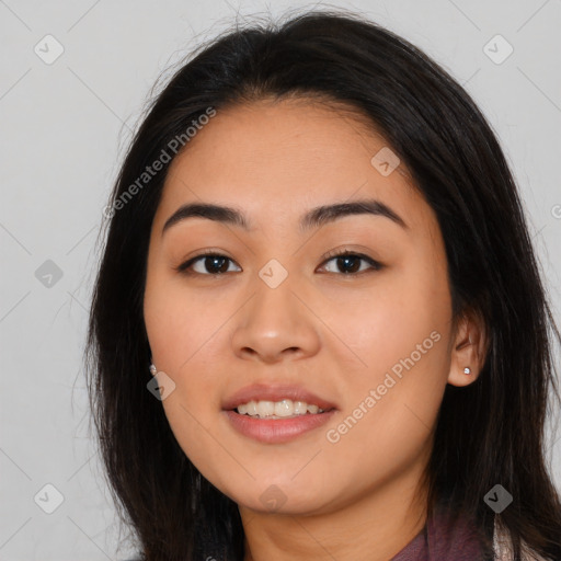 Joyful asian young-adult female with long  brown hair and brown eyes