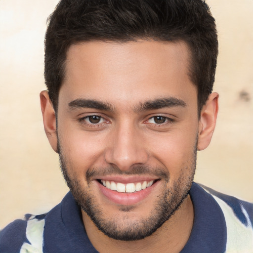 Joyful white young-adult male with short  brown hair and brown eyes