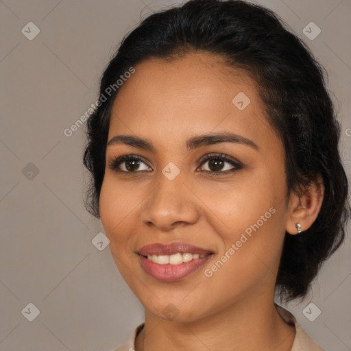 Joyful latino young-adult female with medium  brown hair and brown eyes