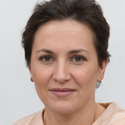 Joyful white adult female with short  brown hair and brown eyes