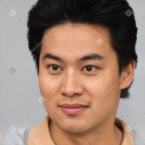 Joyful asian young-adult male with short  brown hair and brown eyes