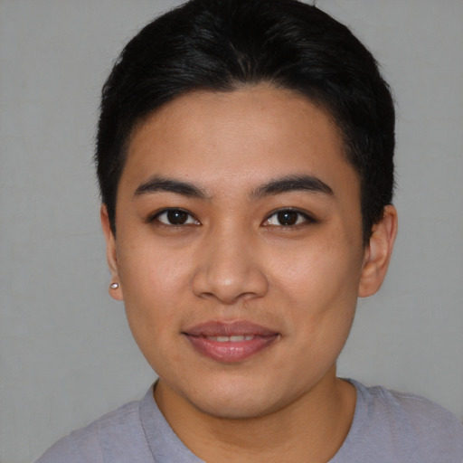 Joyful asian young-adult female with short  black hair and brown eyes