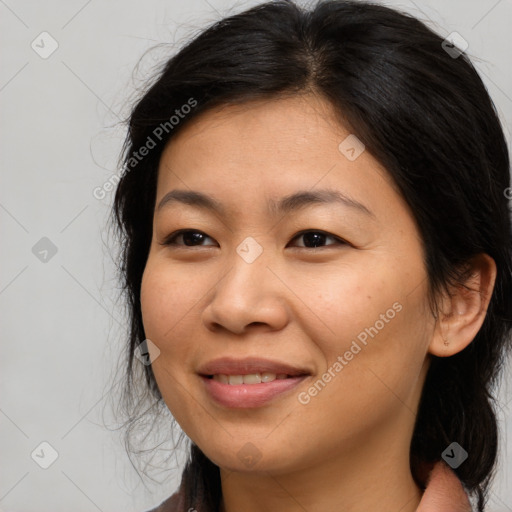 Joyful asian young-adult female with long  brown hair and brown eyes