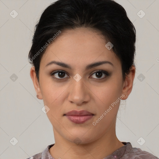 Joyful latino young-adult female with short  brown hair and brown eyes