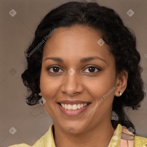 Joyful black young-adult female with medium  brown hair and brown eyes