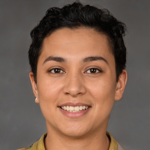Joyful latino young-adult female with short  brown hair and brown eyes