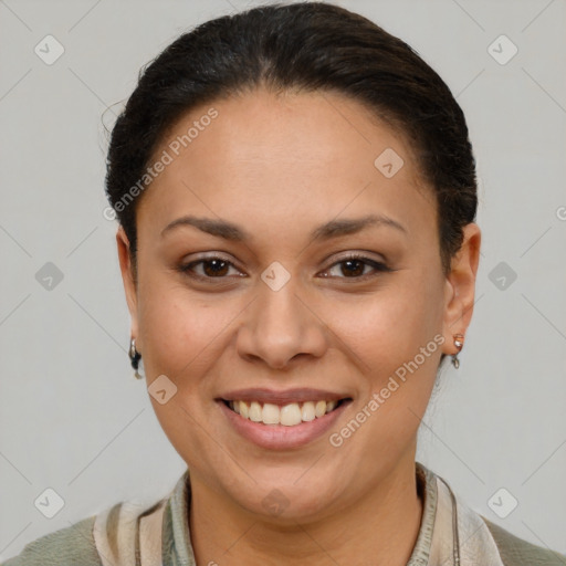 Joyful latino young-adult female with short  brown hair and brown eyes