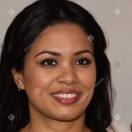 Joyful latino young-adult female with long  brown hair and brown eyes