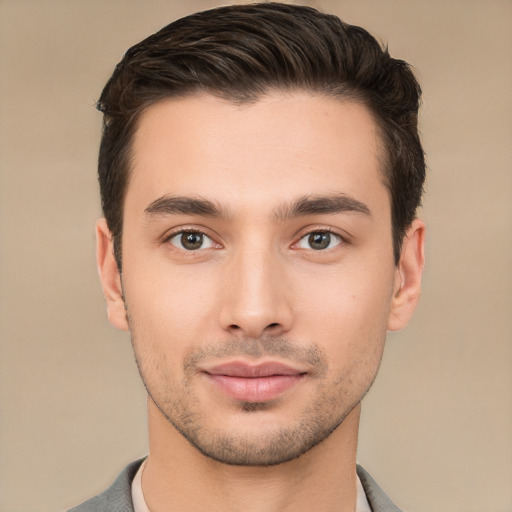 Joyful white young-adult male with short  brown hair and brown eyes