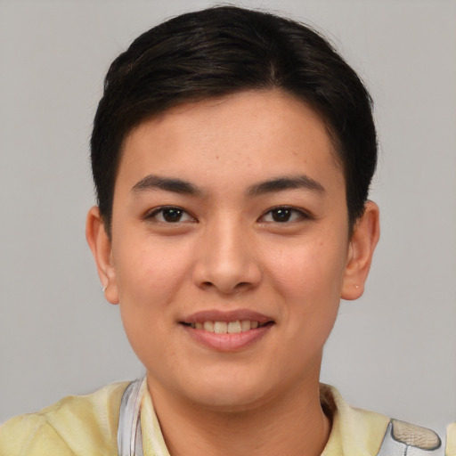 Joyful asian young-adult female with short  brown hair and brown eyes