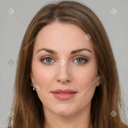 Joyful white young-adult female with long  brown hair and green eyes