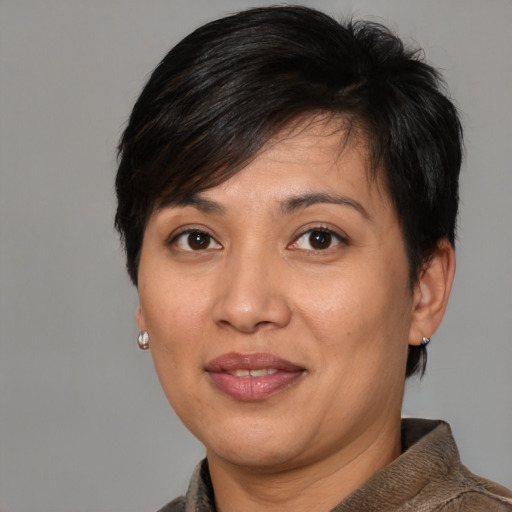 Joyful white adult female with short  brown hair and brown eyes