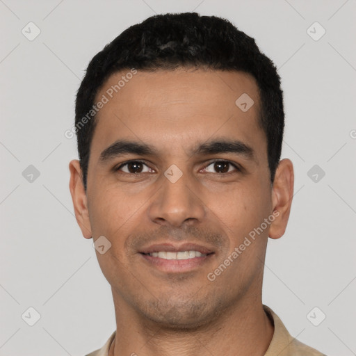 Joyful latino young-adult male with short  black hair and brown eyes