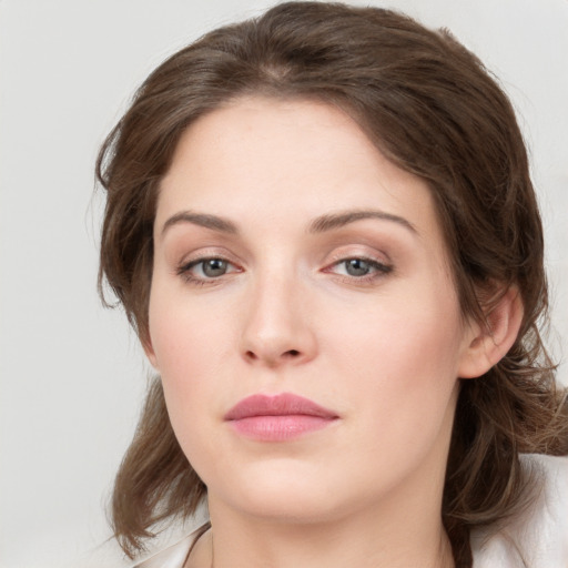 Neutral white young-adult female with medium  brown hair and grey eyes