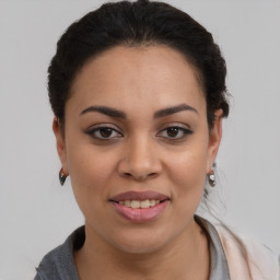 Joyful latino young-adult female with long  brown hair and brown eyes