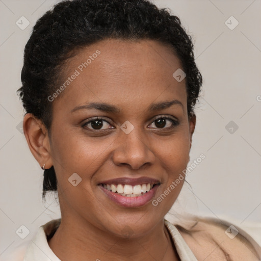 Joyful black young-adult female with short  brown hair and brown eyes