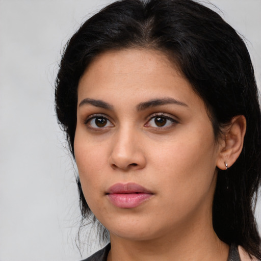 Neutral latino young-adult female with medium  black hair and brown eyes