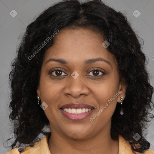 Joyful black young-adult female with long  brown hair and brown eyes