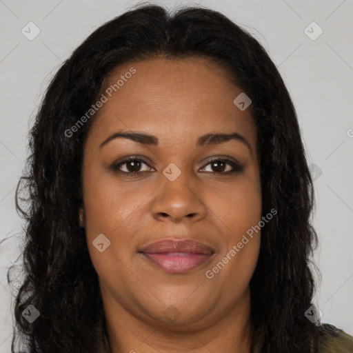 Joyful black young-adult female with long  brown hair and brown eyes