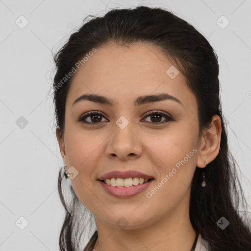 Joyful white young-adult female with long  brown hair and brown eyes