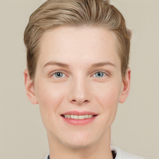 Joyful white young-adult female with short  brown hair and grey eyes