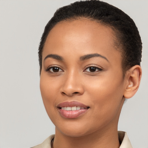 Joyful latino young-adult female with short  brown hair and brown eyes