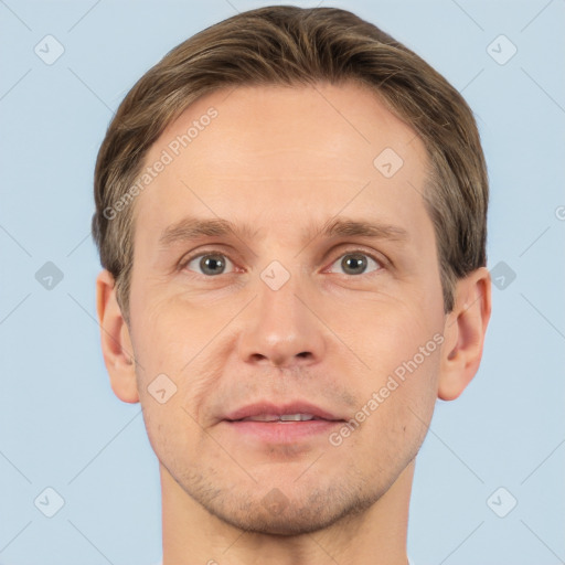 Joyful white adult male with short  brown hair and brown eyes