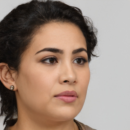 Neutral latino young-adult female with medium  brown hair and brown eyes