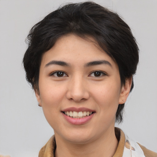 Joyful asian young-adult female with medium  brown hair and brown eyes