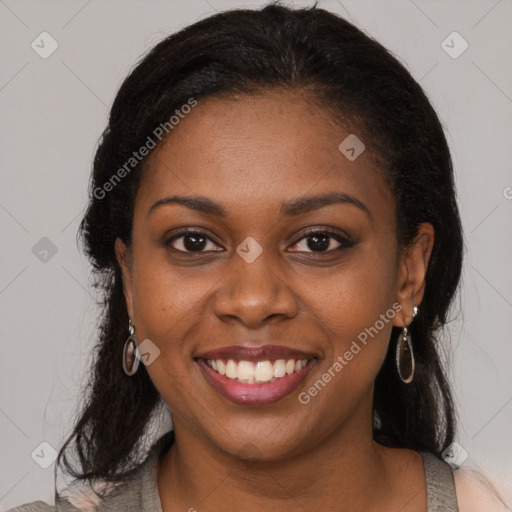 Joyful black young-adult female with medium  brown hair and brown eyes