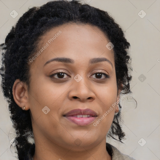 Joyful black young-adult female with long  brown hair and brown eyes