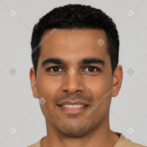 Joyful latino young-adult male with short  black hair and brown eyes