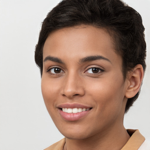 Joyful white young-adult female with short  brown hair and brown eyes