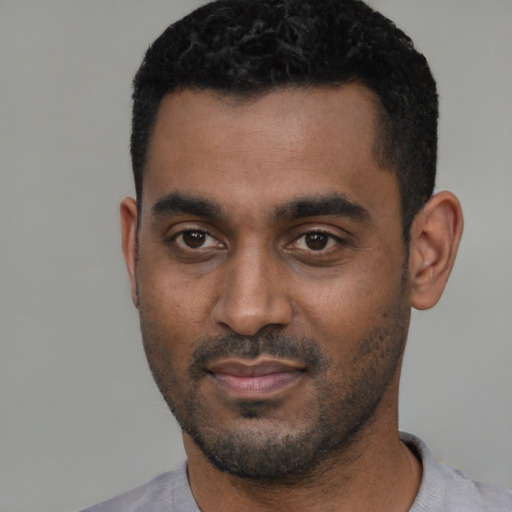 Neutral black young-adult male with short  black hair and brown eyes
