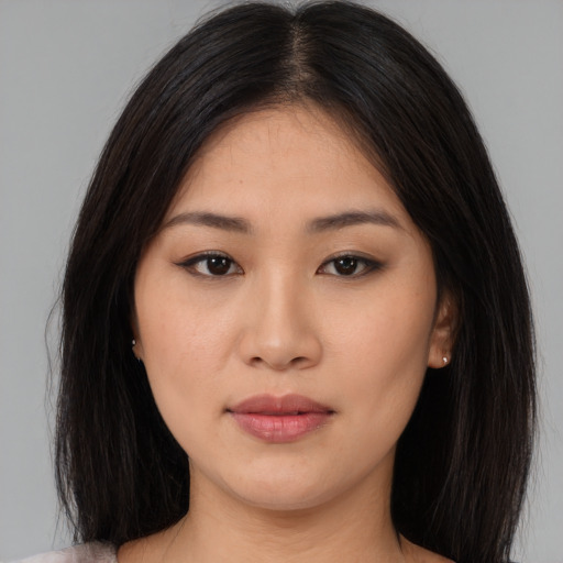 Neutral asian young-adult female with long  brown hair and brown eyes