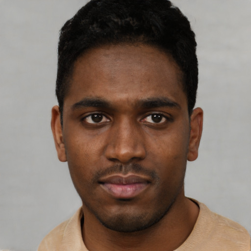 Neutral black young-adult male with short  black hair and brown eyes