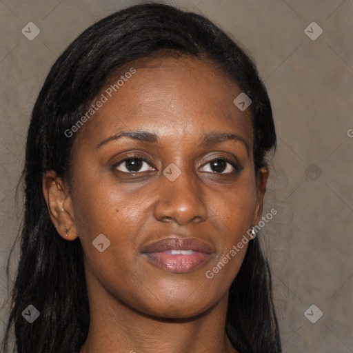 Joyful black young-adult female with long  brown hair and brown eyes