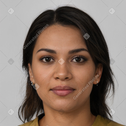 Joyful latino young-adult female with medium  brown hair and brown eyes