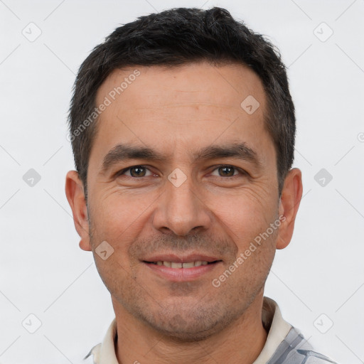 Joyful white adult male with short  brown hair and brown eyes