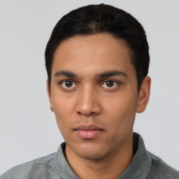 Neutral latino young-adult male with short  black hair and brown eyes