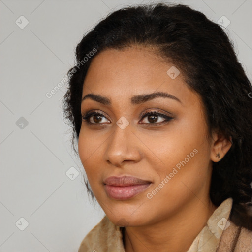 Joyful latino young-adult female with long  brown hair and brown eyes