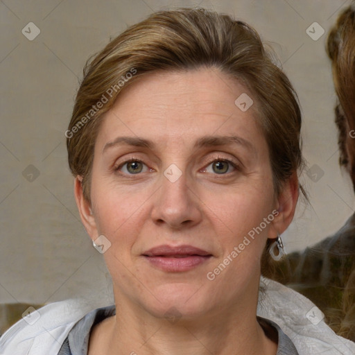 Joyful white adult female with medium  brown hair and grey eyes