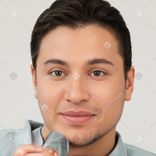 Joyful white young-adult male with short  brown hair and brown eyes