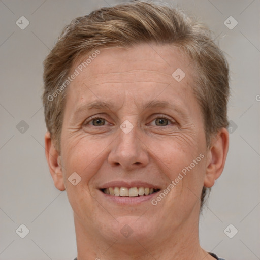 Joyful white adult female with short  brown hair and brown eyes