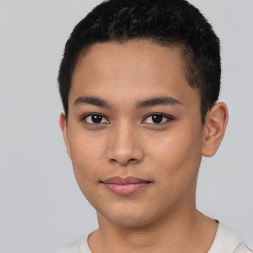 Joyful asian young-adult male with short  black hair and brown eyes