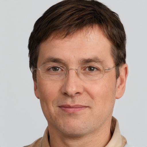 Joyful white adult male with short  brown hair and grey eyes