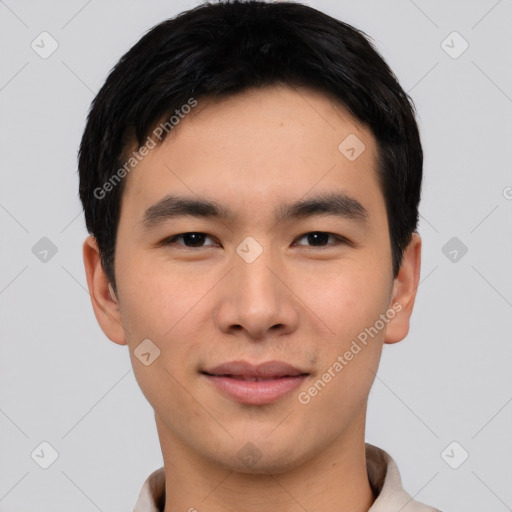 Joyful asian young-adult male with short  black hair and brown eyes