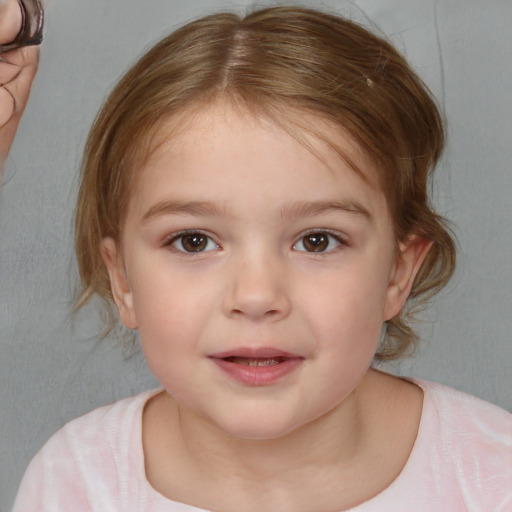 Joyful white child female with medium  brown hair and brown eyes